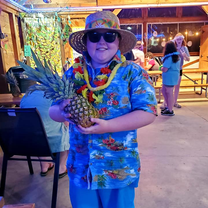 Boy with pineapple